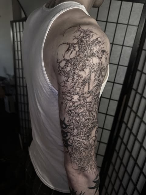 layered black and gray linework sleeve