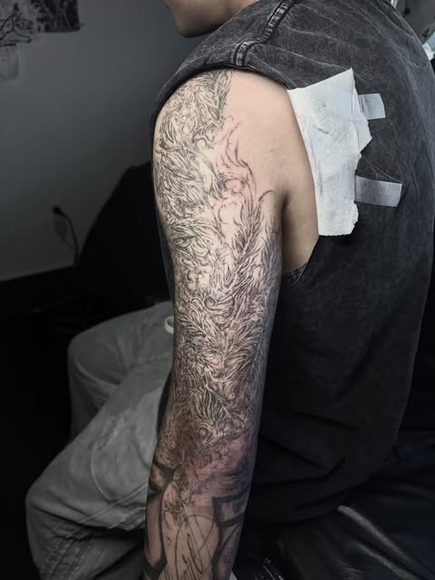 fine-line illustrative upper-arm sleeve
